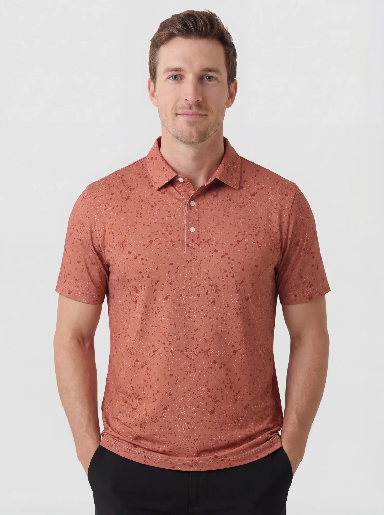 Men's coral speckle print polo in coral / dark coral, front view