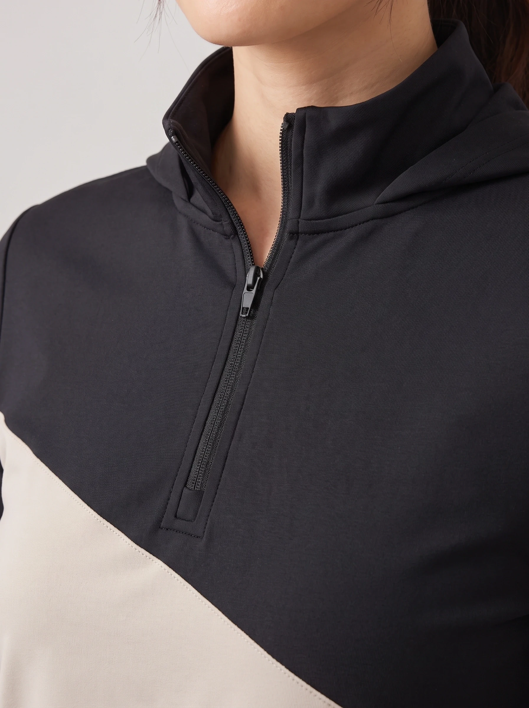 Black Cross Panel Quarter Zip, women zip tops & midlayers, Diagonal panel seam and zipper detail