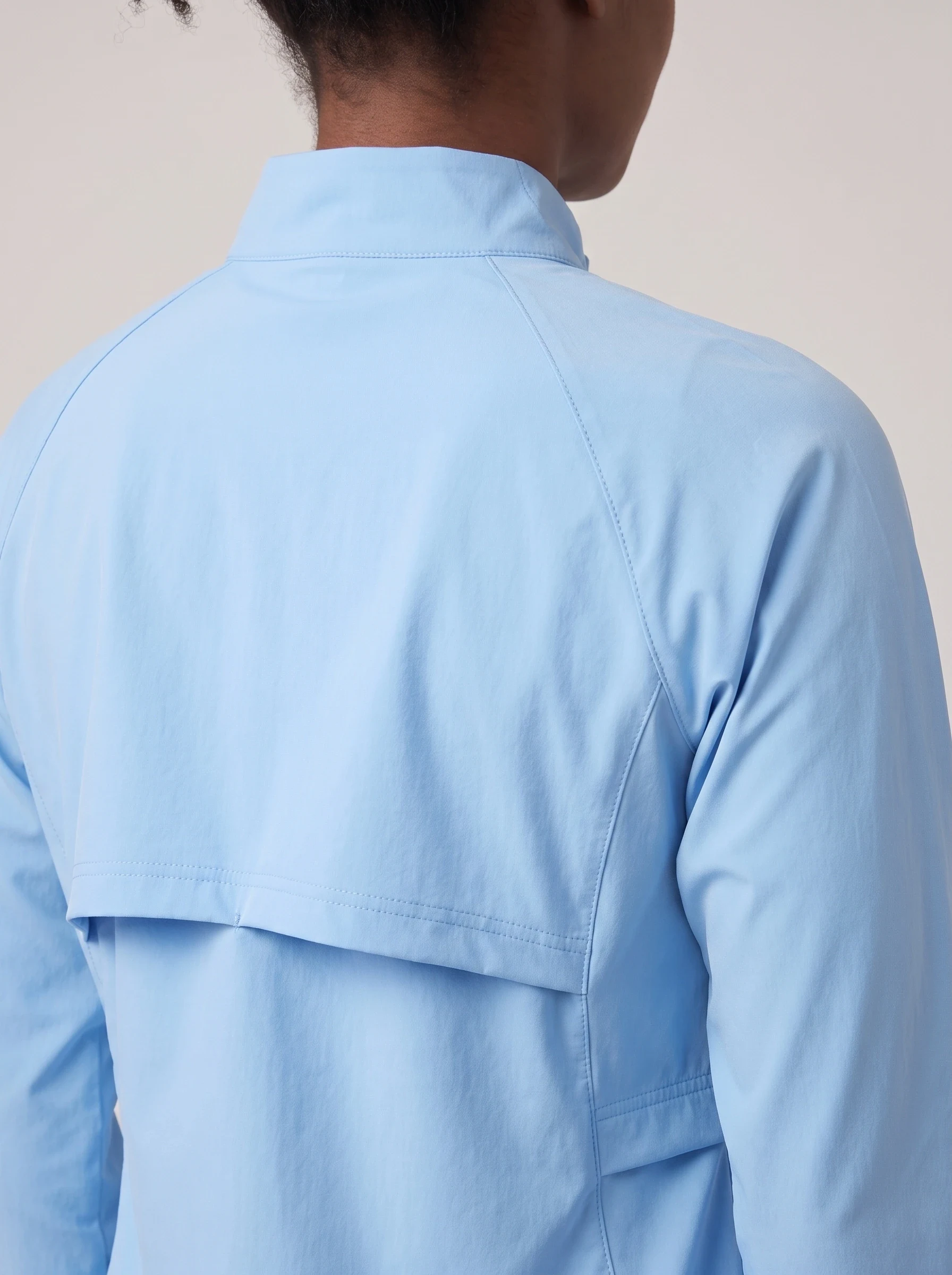 Sky Blue Cape Back Golf Shell, women outerwear, Cape-style rear vent and raglan seam detail