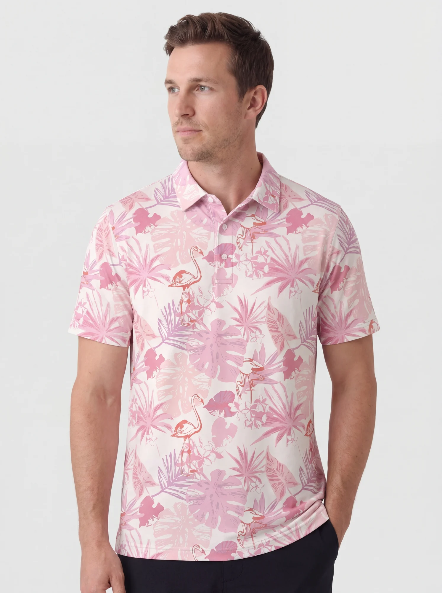 Men's pink tropical foliage print polo in white / pink, front view