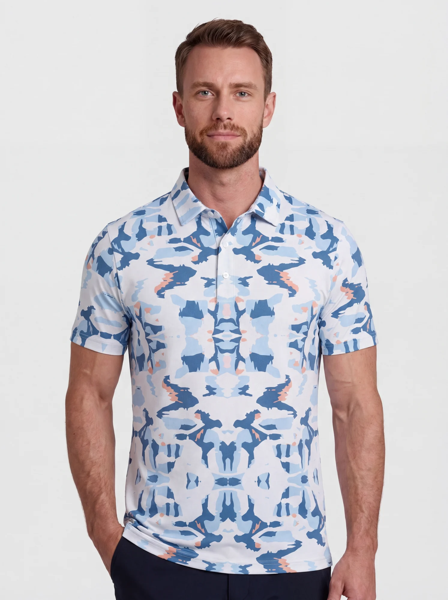 Men's blue mirrored abstract print polo in white / blue / peach, front view