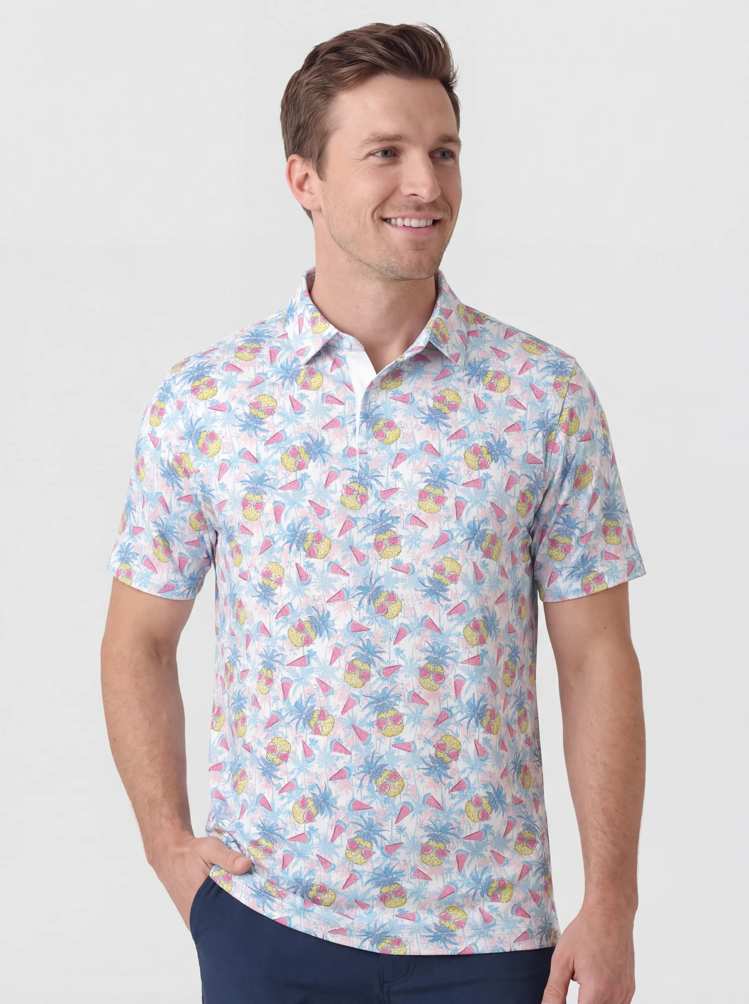 Men's pastel tropical fruit print polo in white / pink / blue / yellow, front view