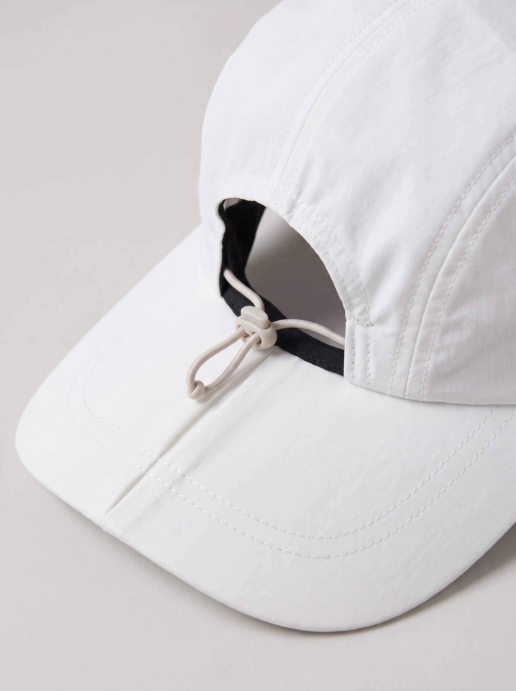 White Fold Brim Travel Cap, unisex caps, Foldable brim center seam and elastic adjuster detail