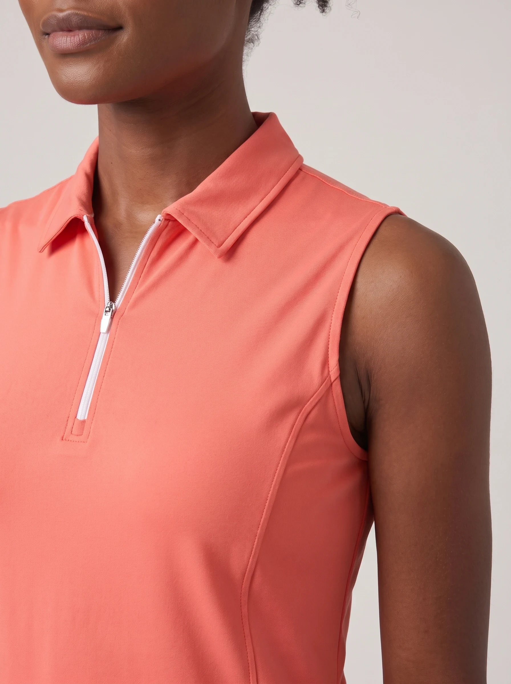 Coral Sleeveless Zip Polo, women solid polos, Sleeveless armhole and zipper detail