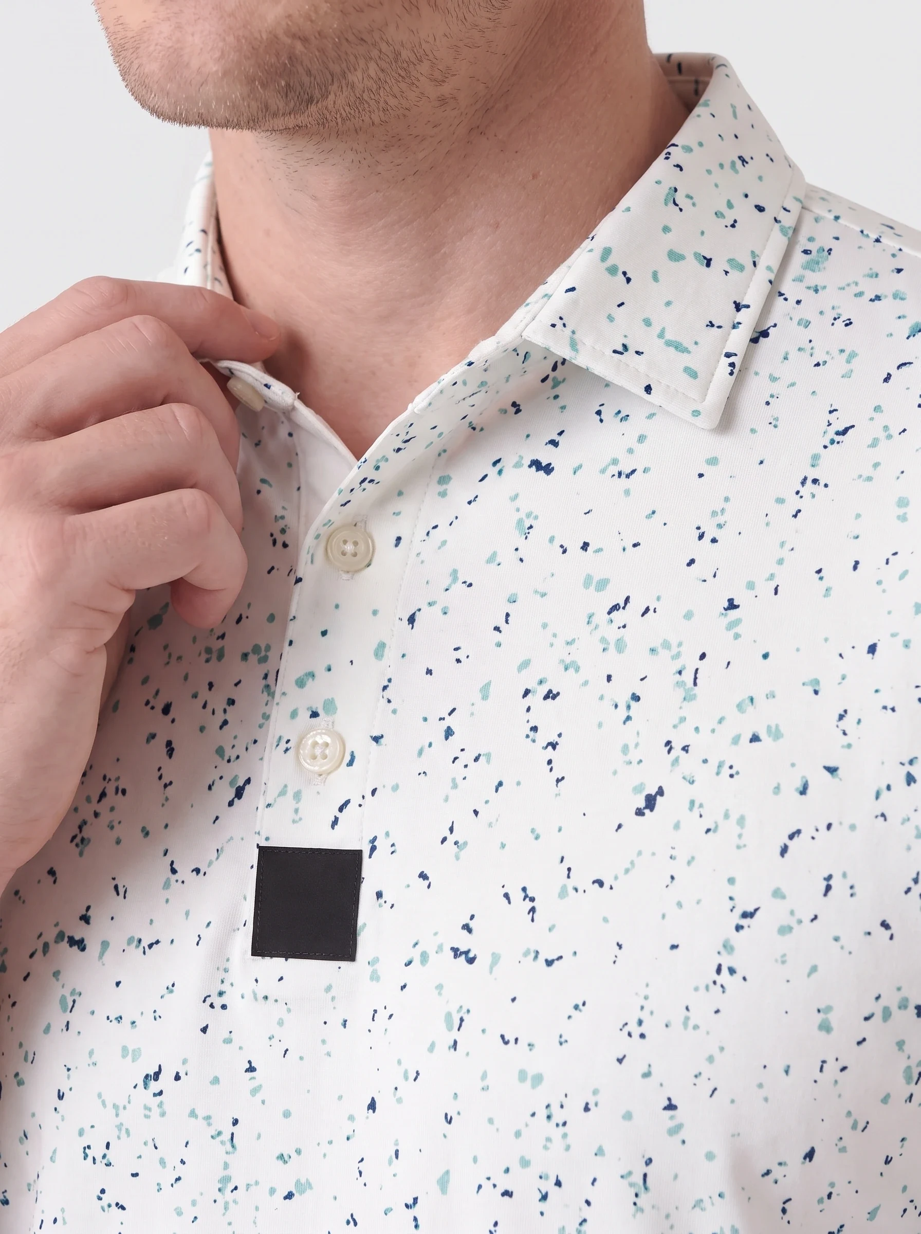 Mint Ink Scatter Print Polo, men printed polos, Printed collar, placket and original repeat detail